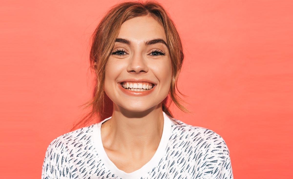 A Girl Smiling Confidently After Cosmetic Dentistry Treatment