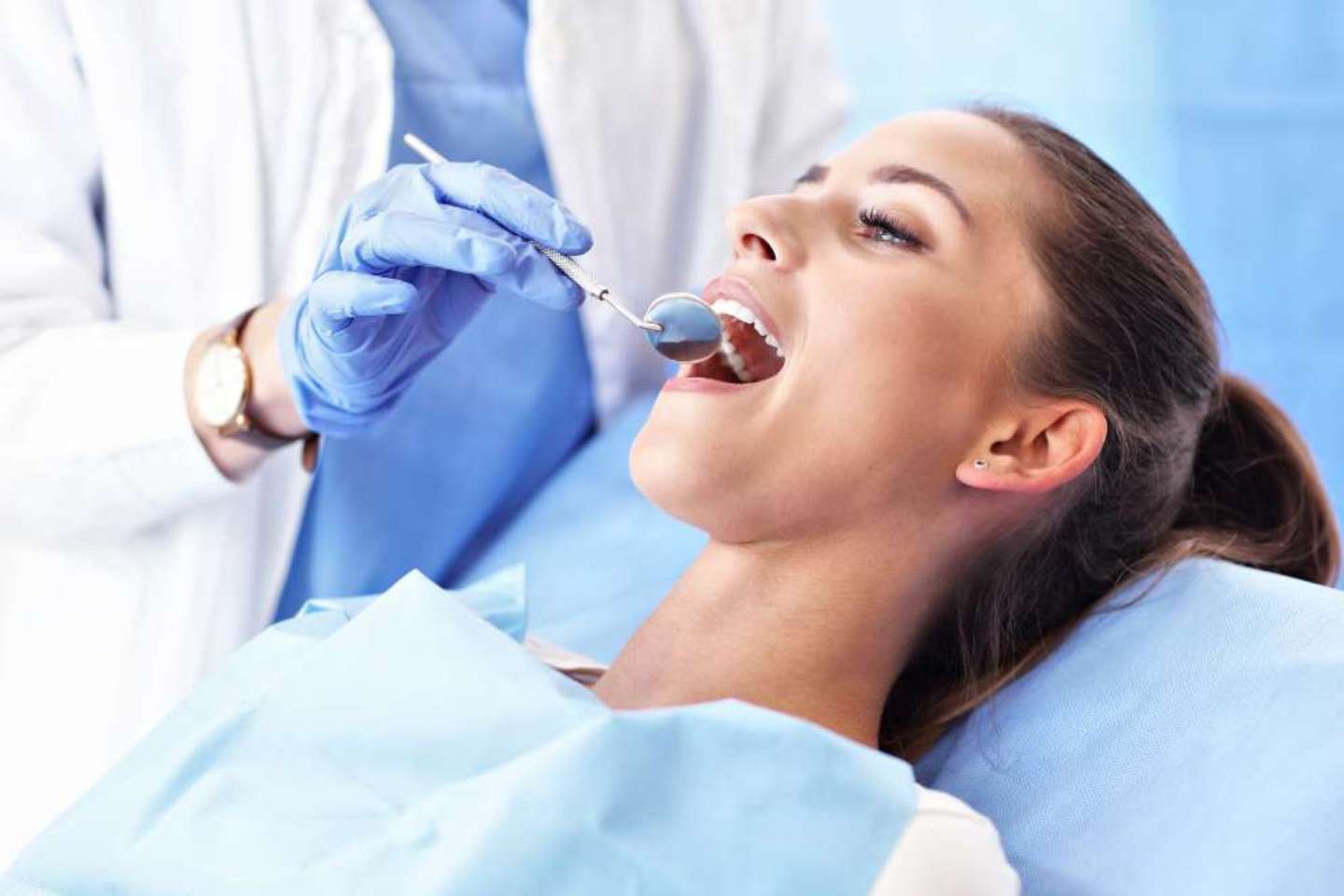 Dentist Examining A Patient's Teeth